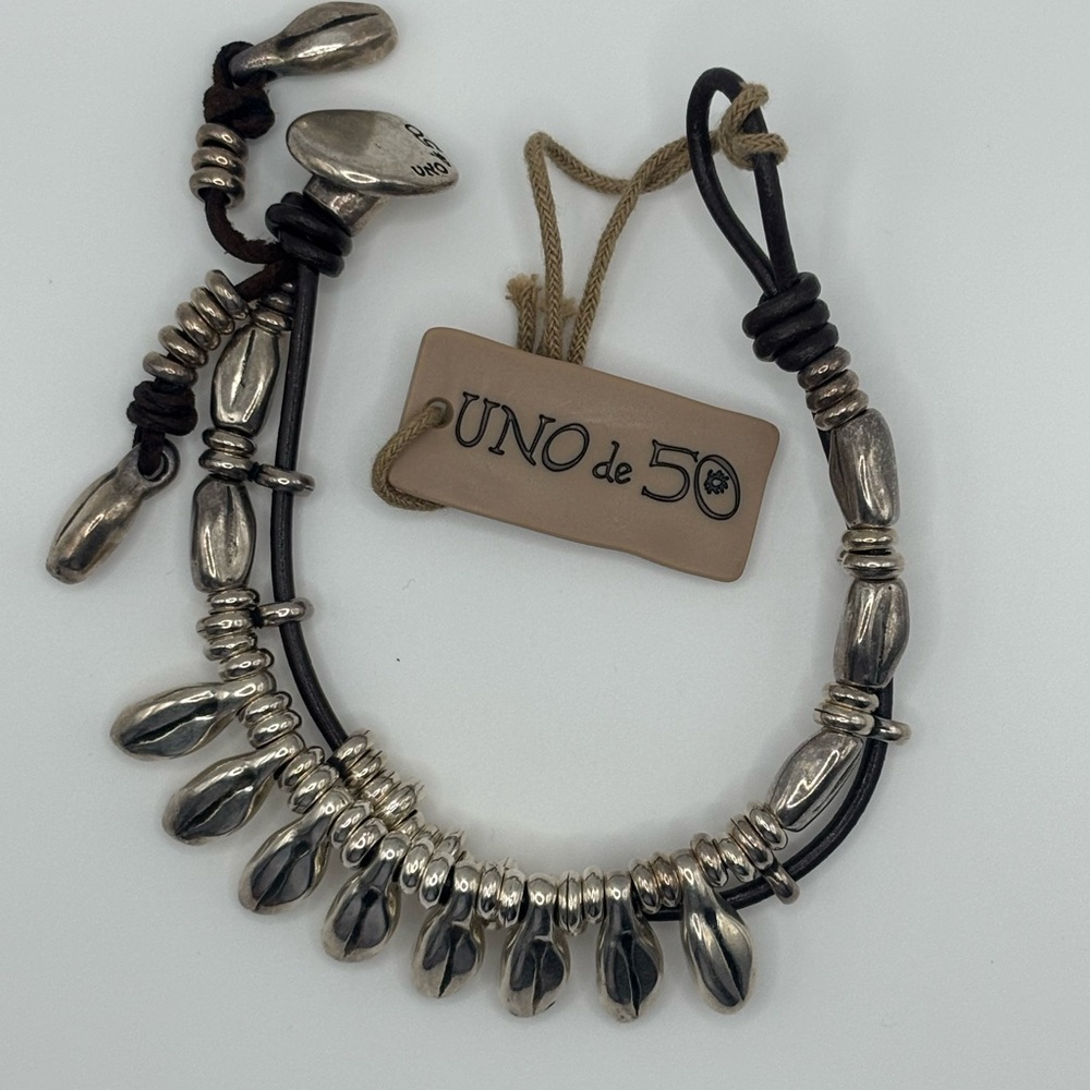 UNO de 50 Metallic Silver and Dark Leather Bracelet. Comes with a dust bag.